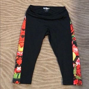 Workout capris black with red floral on side.